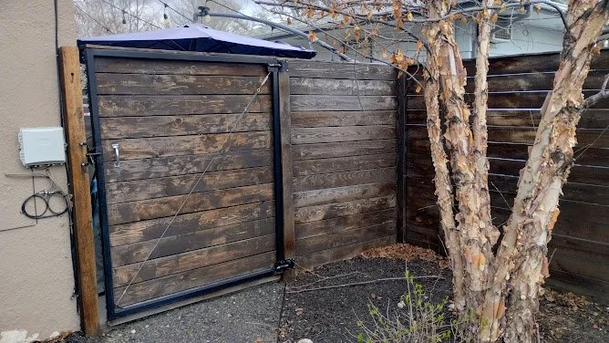 Side-by-side fence section — half stripped, half restored