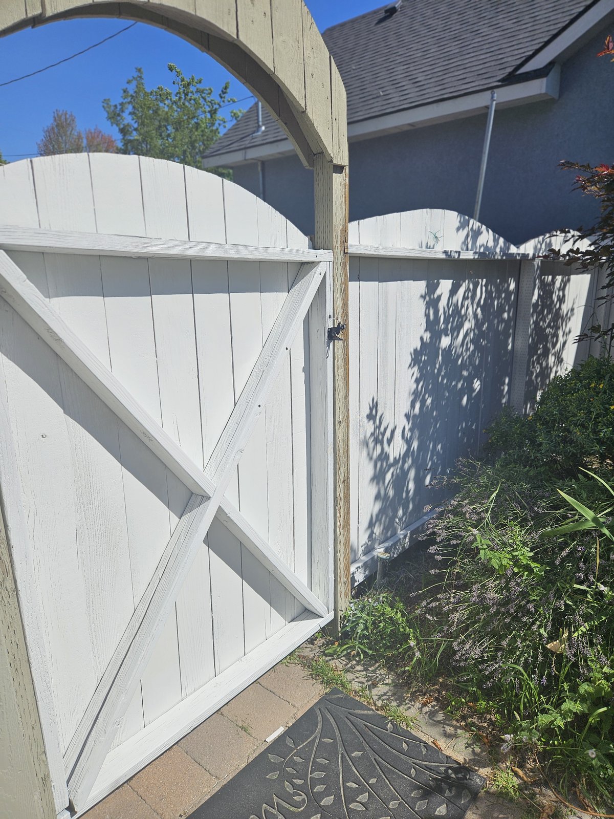 The same gate refinished in a crisp, clean white